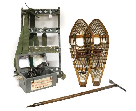 A Murphy Manpack, in green painted aluminium, with green webbing straps; a Pair of Snow Shoes, with wood frames and woven sin