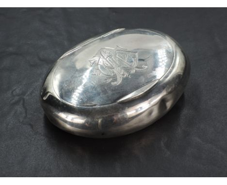 An Edwardian silver snuff box, of oval form curved for the gentleman's pocket, the hinged cover with engraved ownership initi