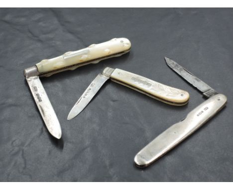A group of two Mother-Of-Pearl mounted and silver bladed fruit knives, sold together with a silver mounted Sheffield steel bl