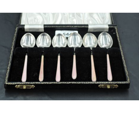 A 1950's cased set of enamelled silver coffee spoons, decorated with engine turned handles with salmon coloured enamelling, t