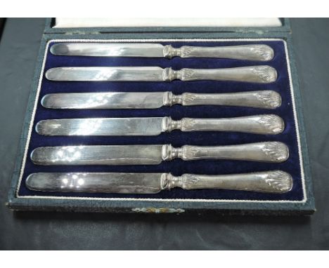 A cased set of six George V silver-handled butter knives, marks for Sheffield 1919, maker R F Mosley &amp; Co.