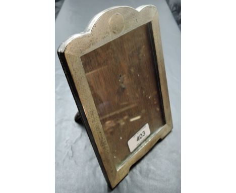 A George V silver photograph frame, of rectangular form with arched surmount and engine-turned decoration, marks for Birmingh