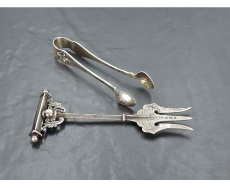 A late Victorian silver trident cold meat fork, with engraved detail and T-form terminal with scrolled brackets, marks for Bi