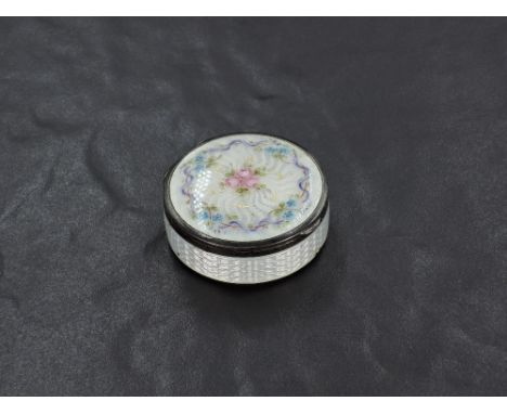 A George V silver and guilloche enamel circular box, the engine-turned surface enamelled and painted with foliate decoration,