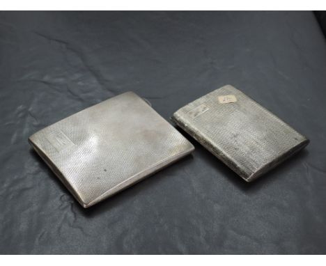 A George V silver cigarette case, of hinged rectangular form, with engine-turned decoration and rectangular cartouche, engrav