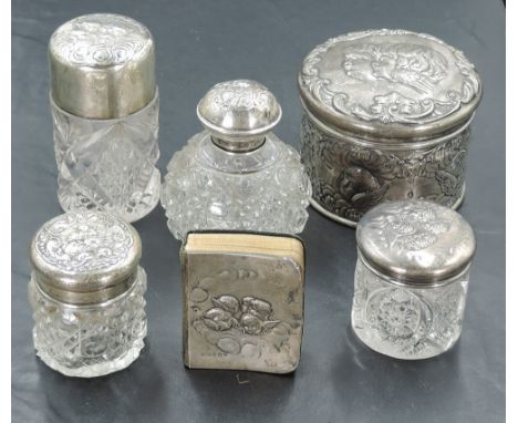 A selection of Edwardian silver mounted dressing table wares, comprising a hair brush, various dressing table jars, button ho