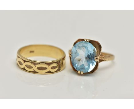 TWO 9CT GOLD RINGS, the first designed with a double four claw set, oval cut light blue topaz, in an openwork scallop gallery