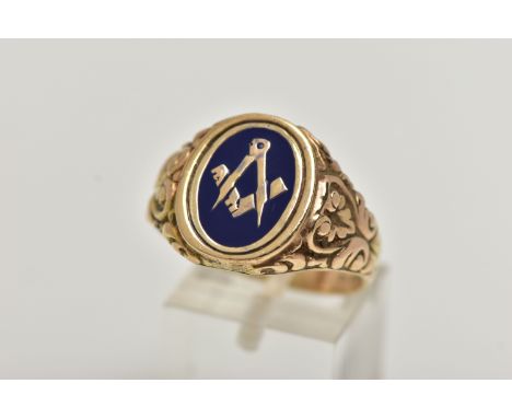 A HEAVY 9CT GOLD MASONIC ENAMEL RING, of an oval form decorated with blue enamel, scrolling embossed detail to the shoulders,
