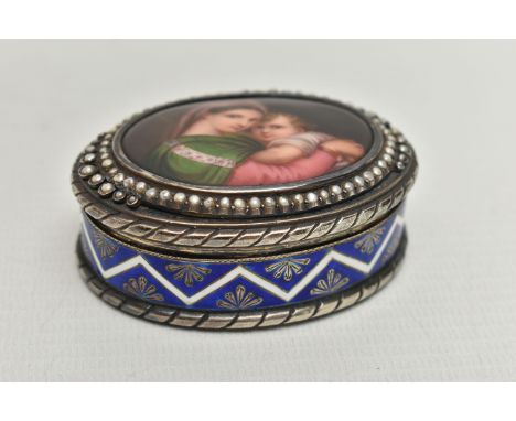A LATE 19TH CENTURY CONTINENTAL SILVER, ENAMEL AND PORCELAIN SNUFF BOX OF OVAL FORM, the hinged cover set with a border of se