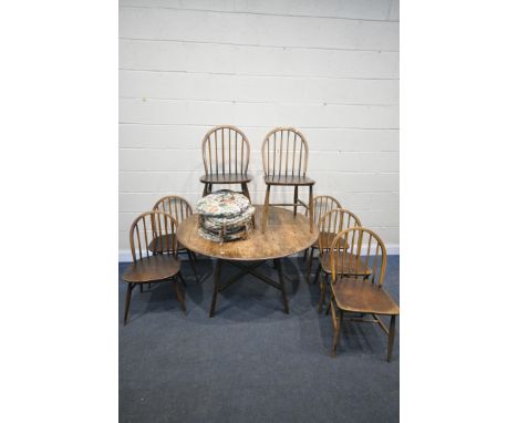 AN ERCOL MODEL 377 OVAL DROP LEAF TABLE, open length 125cm x closed length 62cm x depth 113cm x height 72cm, along with a set