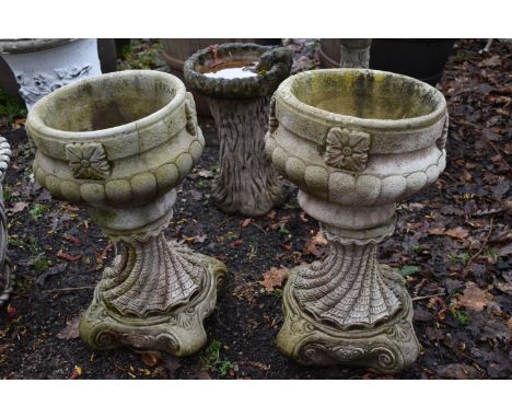 A PAIR OF WEATHERED COMPOSITE COMPAGNA GARDEN URNS, on a separate neo classical base, diameter 35cm x height 59cm (condition:
