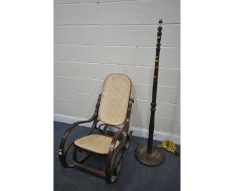 A THONET STYLE BENTWOOD ROCKING CHAIR, with cane seat and back, along with a standard lamp (2)