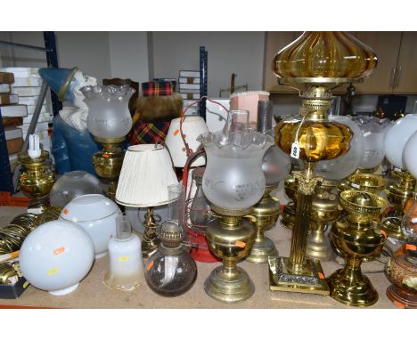 A QUANTITY OF LAMPS AND SHADES, oil lamps and electric table lamps, to include a tall Duplex oil lamp with amber glass reserv