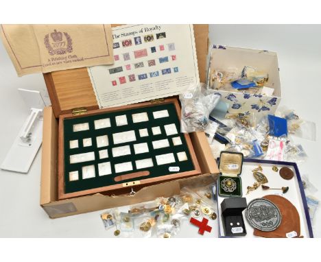 A CASED SET OF SILVER STAMPS AND A BOX OF PIN BADGES, 'The Stamps of Royalty' silver stamp collection in presentation box and