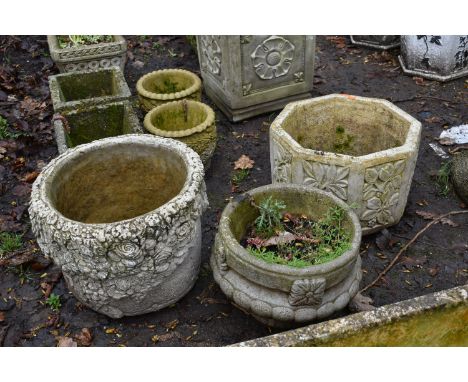 A WEATHERED COMPOSITE OCTAGONAL PLANTER, diameter 39cm x height 27cm, a circular floral planter, and a garden urn (3)