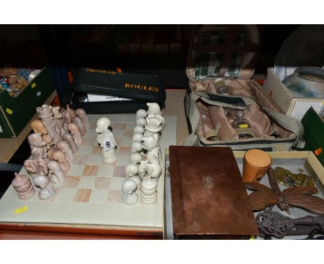 A SOAPSTONE CHESS BOARD,  with hand carved tribal design  chess pieces, a  cased set of Proteam Sports Boules, a nylon carry 