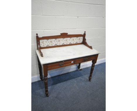 AN EDWARDIAN MAHOGANY MARBLE TOP WASHSTAND, with a tile back, and two drawers, width 107cm x depth 51cm x height 103cm (condi