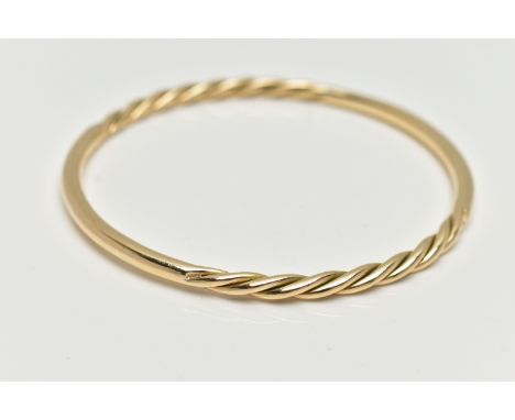 A 9CT YELLOW GOLD BANGLE, twist and polished bangle, hallmarked 9ct Birmingham, approximate internal diameter 66.5mm, approxi