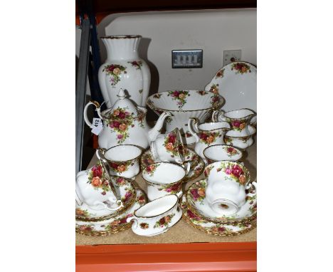 A ROYAL ALBERT 'OLD COUNTRY ROSES' PATTERN TEA SET, comprising a teapot (cracked lid), cake plate, two milk jugs (one has a h