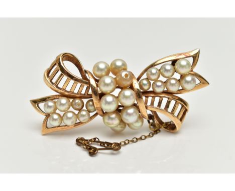 A YELLOW METAL 'MIKIMOTO' CULTURED PEARL BOW BROOCH, openwork bow set with two rows of cultured pearls (two replacement pearl