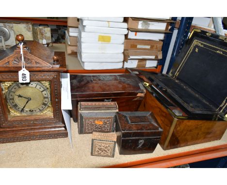 A MANTEL CLOCK AND VARIOUS WOODEN BOXES, comprising a wooden cased mantel clock, carved with floral and geometric motifs, hav
