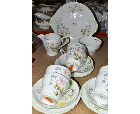 A TWENTY ONE PIECE SHELLEY 'WILD ANEMONE' TEA SET, pattern 13977, comprising a cake plate, a cream jug, a sugar bowl, and six