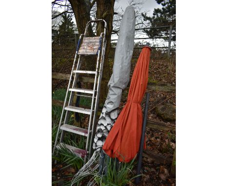 A HARTMAN ORANGE WIND OUT PARASOL, along with a garden clothes airer and an aluminium step ladder (3)