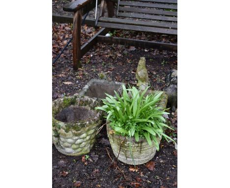 TWO CIRCULAR WEATHERED COMPOSITE PLANTERS, one with shells and the other with as brick effect, 38cm diameter x height 29cm, a