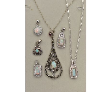 TWO PENDANT NECKLACES AND FOUR PENDANTS, the first pendant of an openwork tear drop shape, set with marcasite and synthetic o