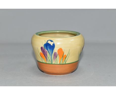 A CLARICE CLIFF CROCUS PATTERN MARMALADE POT, painted with purple, blue and orange crocuses, green and orange bands, height 6