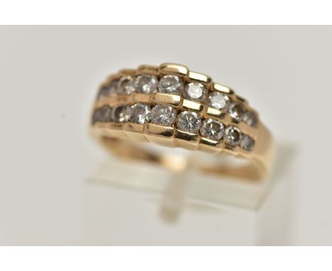 A 14CT GOLD DIAMOND RING, designed as two rows of graduating round brilliant cut diamonds, in a stepped setting, estimated to