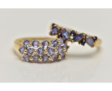 TWO 9CT GOLD TANZANITE RINGS, the first designed with a row of three circular cut tanzanite, sixteen in total, each in a shar