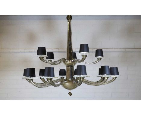 A Holly Hunt fifteen-light glass chandelier, of recent manufacture, with wrythen smoked glass arms around a tapering column,1