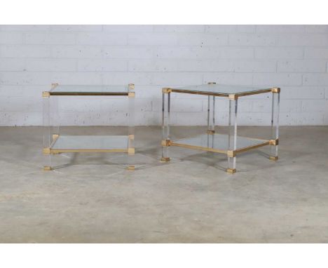 A pair of Pierre Vandel side tables, c.1970, each of square form with a glass top and shelf, within a Lucite and gilded-brass