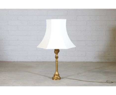 After Alberto Giacometti, a gilt-metal 'Tête de Femme' table lamp, contemporary, originally designed in 1937, stamped marks, 