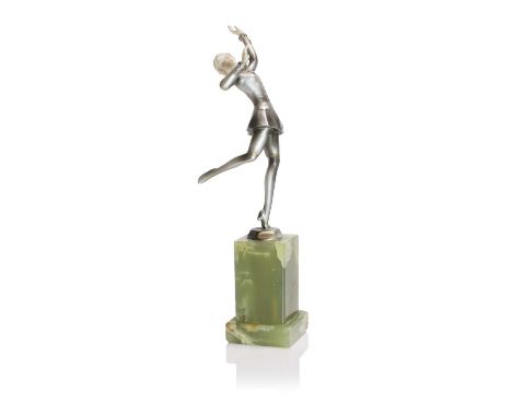 Josef Lorenzl (Austrian, 1892-1950), a gold-painted and ivory figure of a dancing woman, modelled in a skirt and blazer on an