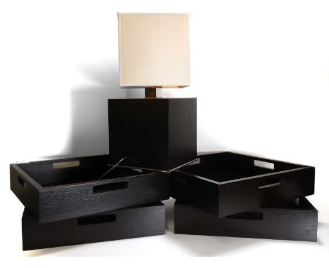 A lacquered wood table lamp, by Modernature, Paris, with a square cream shade,54.5cm high, and four matched trays, each with 
