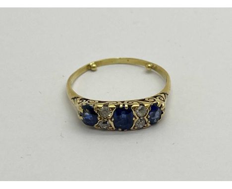 A Victorian Style Sapphire and Diamond Set Ring, graduated oval claw set, with old and single cut diamond spacers (approximat