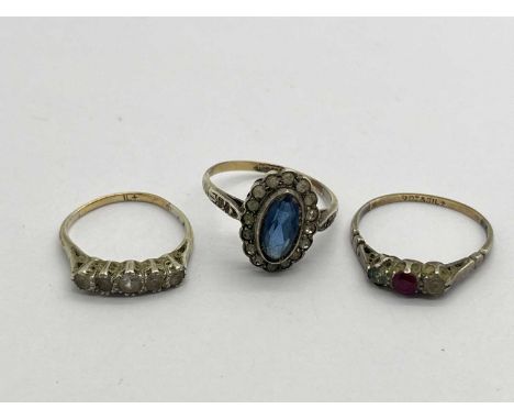 Three Vintage Style Stone Set Rings, to include elongated halo style, three stone, five stone, (damages), stamped "9ct &amp; 