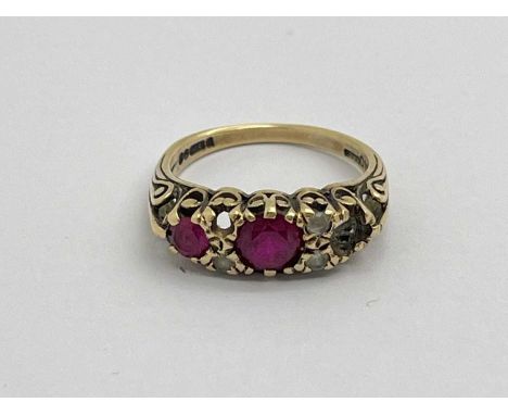 A 9ct Gold Victorian Style Dress Ring, alternate claw set graduated stones (losses), within openwork setting, between fancy t