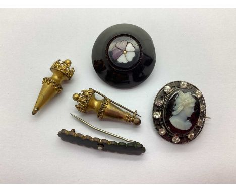 A Victorian Pietra Dura and Jet Circular Brooch, highlighted in purple and white; a Victorian black enamel bar brooch, a came