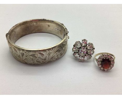 A Wide Hallmarked Silver Bangle, part foliate engraved panel, to snap clasp (lacking safety chain) (44.5grams), together with