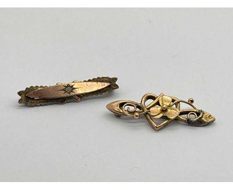 A Stone Set Victorian Brooch, of boat shape, starburst decoration to centre (loses), together with a Celtic style ornate broo