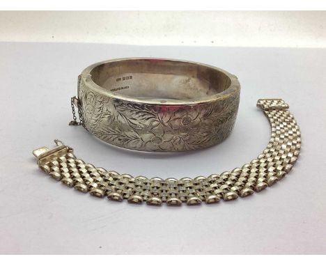 A Vintage Hallmarked Silver Hinged Bangle, the etched floral design, to push clasp and safety chain, (Birmingham, 1965), toge