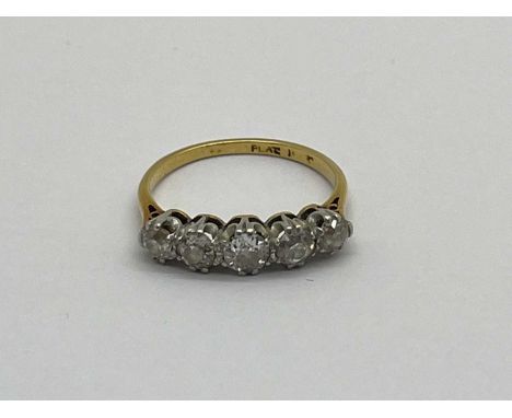 A Vintage Five Stone Diamond Ring, graduated claw set with old cut stones, stamped "Plat" (marks rubbed) (finger size K).