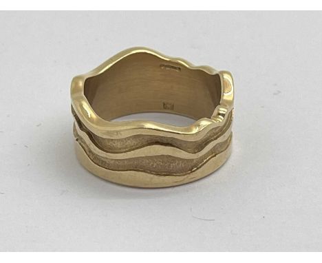 A Modern 9ct Gold Wide Band Ring, of wavy design, polished and textured finish (finger size T) (12grams).