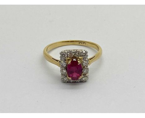 A Diamond Set Rectangular Cluster Ring, oval four claw set to the centre, within single cut diamond set border (finger size N