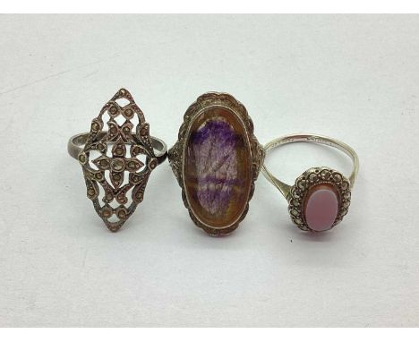 A Hallmarked Silver Blue John Ring, within an ornately decorated border, together with a hallmarked silver chalcedony and mar