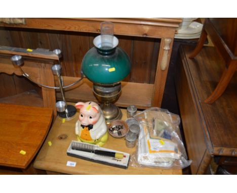 A brass oil lamp; a candelabra; a money bank; glass tidy jars etc. 