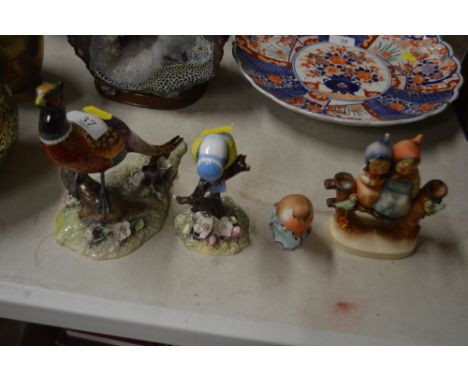 A Royal Crown Derby pheasant; a Royal Crown Derby blue tit AF; together with a Royal Worcester robin; and a Goebel figure gro